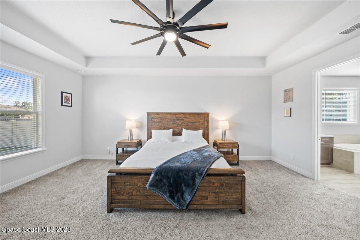 1582 Killian Drive Palm Bay, FL 32905 - Photo 15 of 37 a bedroom with a bed and window