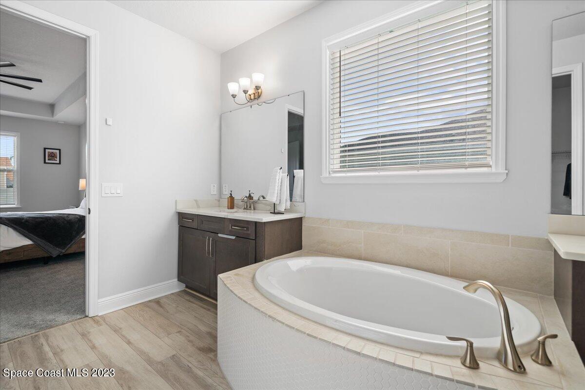 1582 Killian Drive Palm Bay, FL 32905 - Photo 17 of 37 a bathroom with a bathtub and a sink