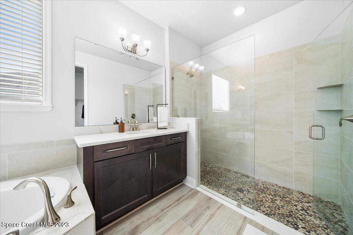 1582 Killian Drive Palm Bay, FL 32905 - Photo 18 of 37 a spacious bathroom with a shower sink and mirror