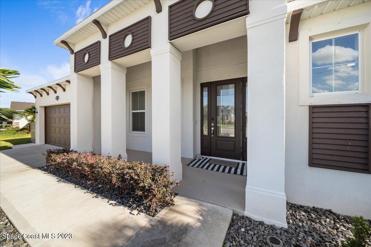 1582 Killian Drive Palm Bay, FL 32905 - Photo 2 of 37 a view of a house with a large windows