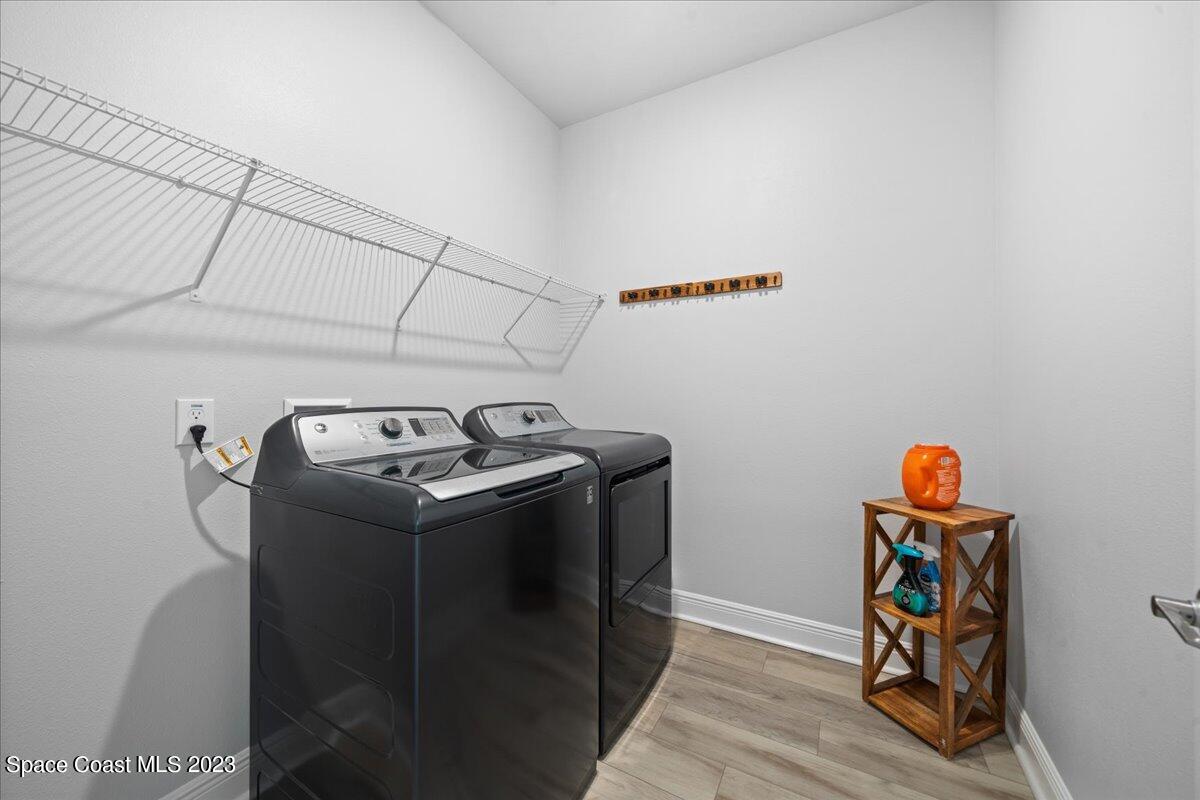 1582 Killian Drive Palm Bay, FL 32905 - Photo 28 of 37 a utility room with dryer and washer