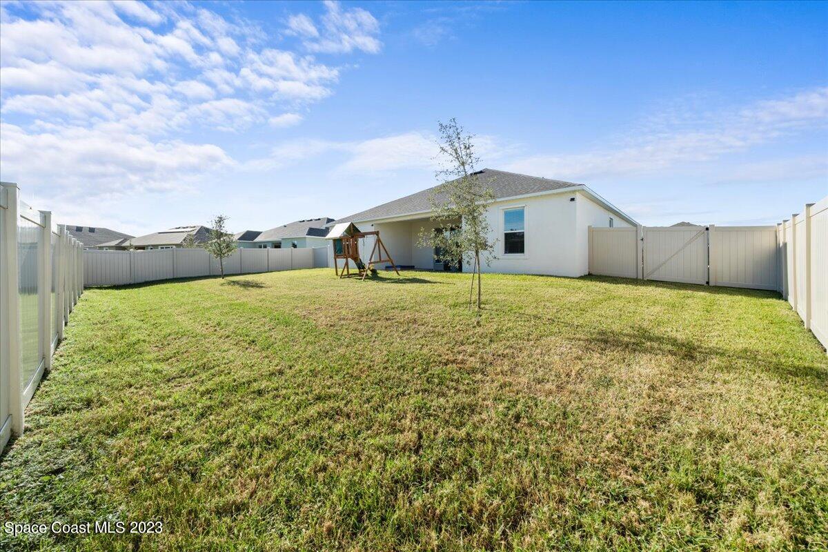 1582 Killian Drive Palm Bay, FL 32905 - Photo 29 of 37 a bathroom with a sink and a yard