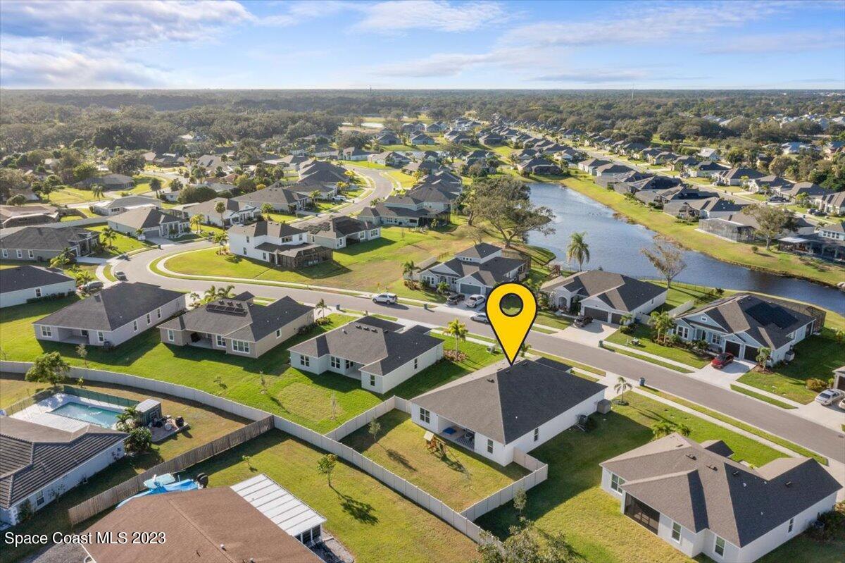 1582 Killian Drive Palm Bay, FL 32905 - Photo 32 of 37 an aerial view of residential houses with outdoor space