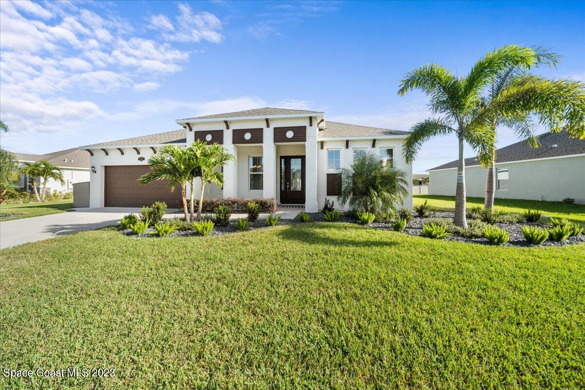1582 Killian Drive Palm Bay, FL 32905 - Photo 36 of 37 front view of a house with a yard