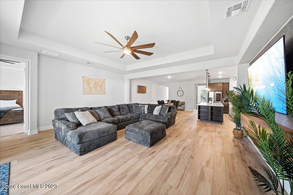 1582 Killian Drive Palm Bay, FL 32905 - Photo 10 of 37 a living room with furniture and a large window