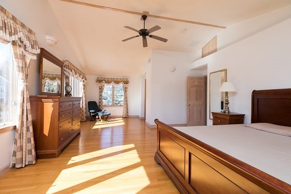 40 Crescent Road Hamilton, MA 01982 - Photo 14 of 28 a large bedroom with a bed and a view of living room