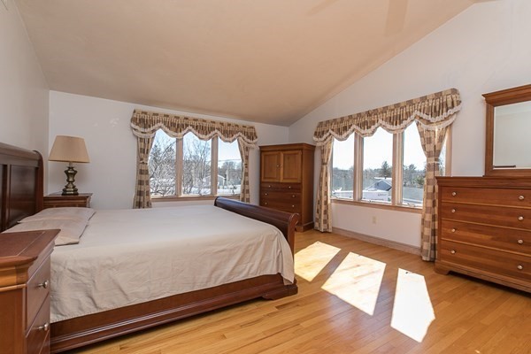 40 Crescent Road Hamilton, MA 01982 - Photo 15 of 28 a bed sitting in a spacious bedroom next to a window
