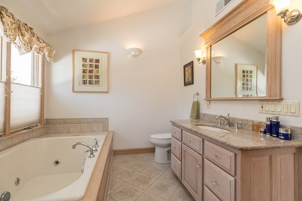 40 Crescent Road Hamilton, MA 01982 - Photo 18 of 28 a bathroom with a tub sink and mirror