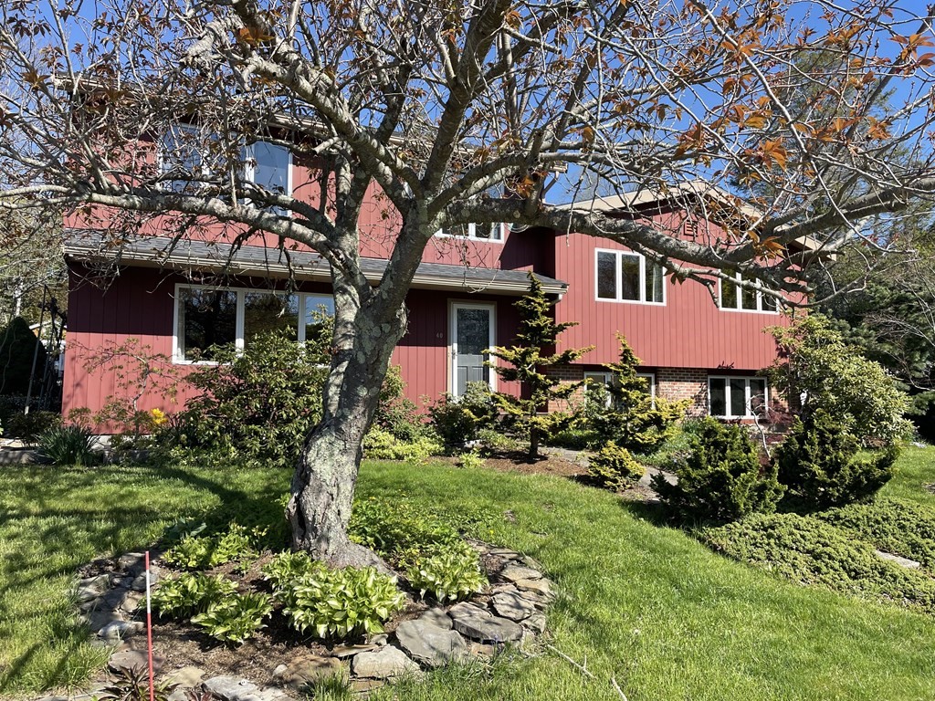 40 Crescent Road Hamilton, MA 01982 - Photo 2 of 28 a front view of a house with a yard and fountain