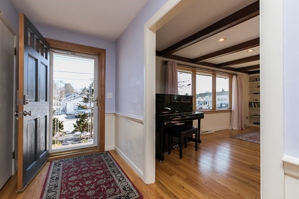 40 Crescent Road Hamilton, MA 01982 - Photo 3 of 28 a view of a hallway and wooden floor and a dining room