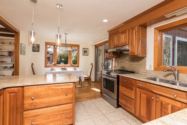 40 Crescent Road Hamilton, MA 01982 - Photo 7 of 28 a kitchen with stainless steel appliances kitchen island granite countertop a sink and cabinets