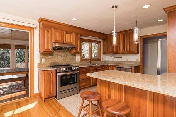 40 Crescent Road Hamilton, MA 01982 - Photo 8 of 28 a kitchen with stainless steel appliances granite countertop a stove a sink and a refrigerator