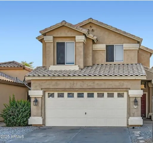 a front view of a house with a wooden balcony