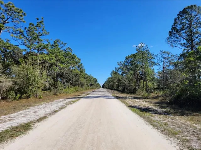 a view of a street with a house