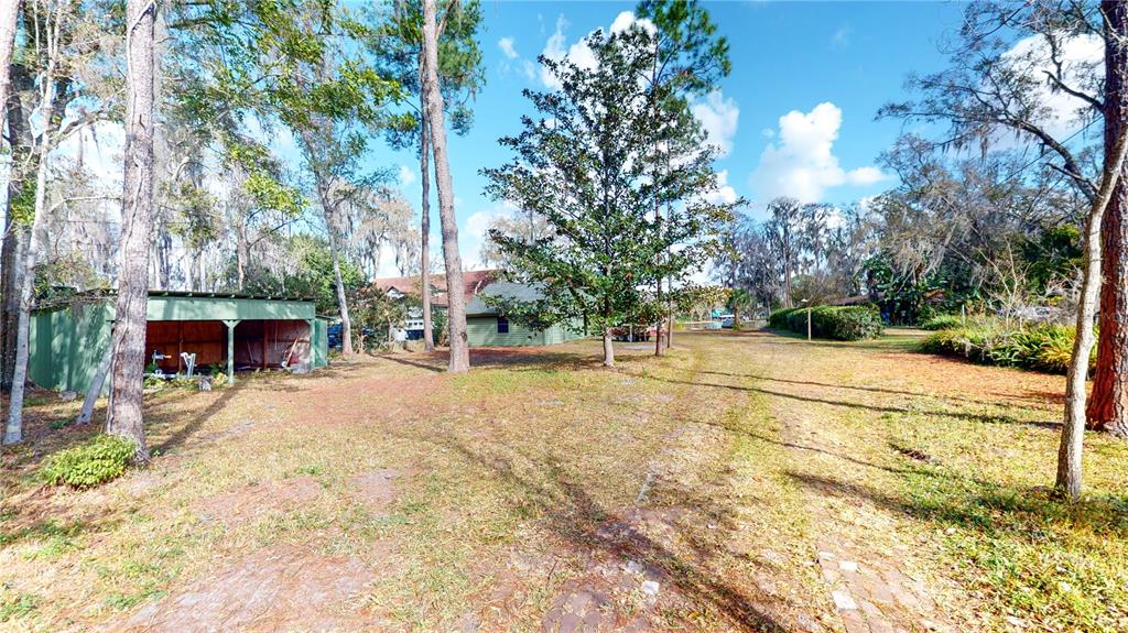 19803 Reading Road Lutz, FL 33558 - Photo 4 of 48 a view of a house with a yard and garage