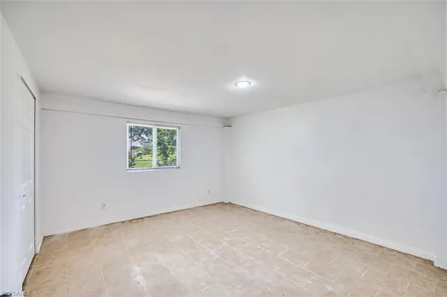 an aerial view of a house with a yard and garden