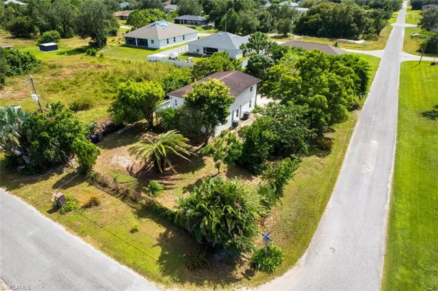 an aerial view of residential house with outdoor space and swimming pool