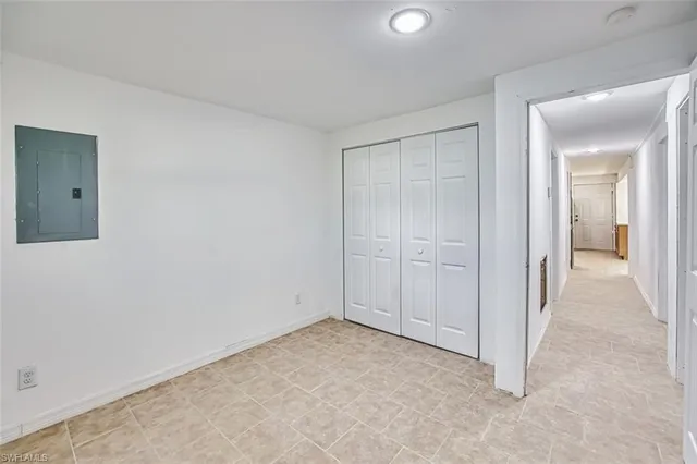 a view of a hallway with wooden shelves