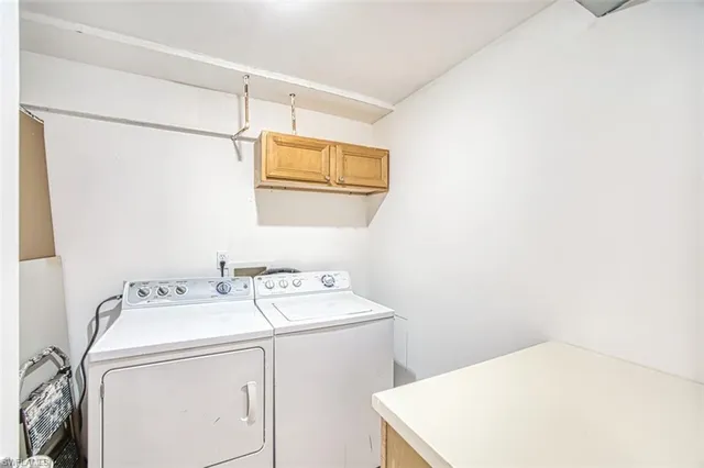 a view of kitchen with center island and stainless steel appliances