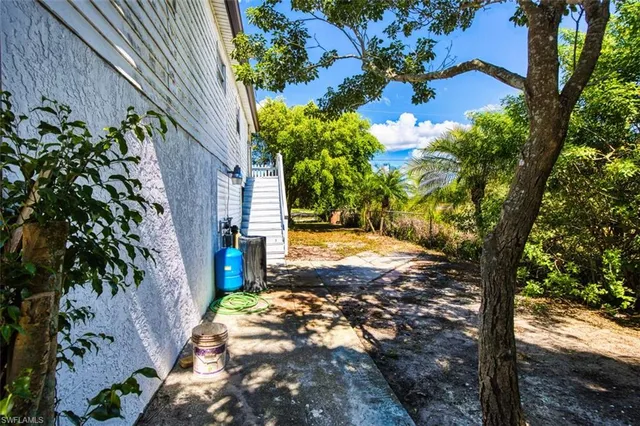 a kitchen that has a sink cabinets counter space and appliances