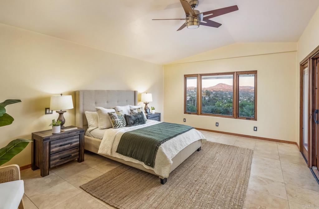 2202 Mountain Vista Drive Encinitas, CA 92024 - Photo 15 of 28 a bedroom with a large bed and a large window
