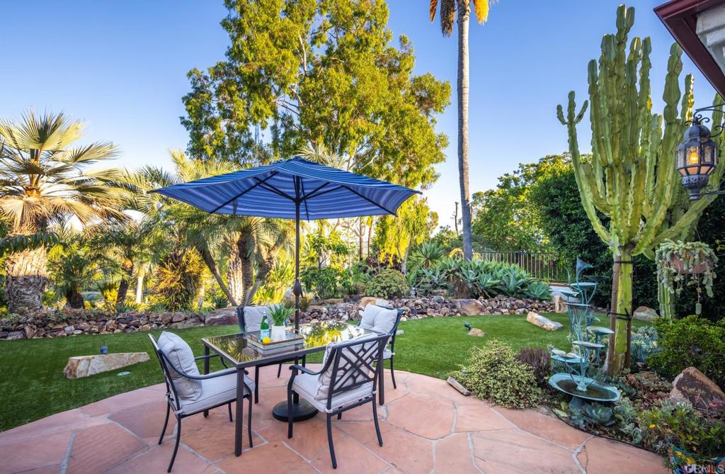 2202 Mountain Vista Drive Encinitas, CA 92024 - Photo 21 of 28 a view of a chair and table with umbrella in the garden