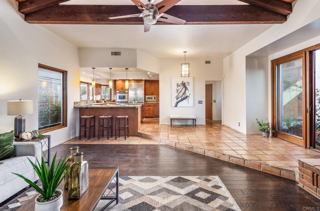 2202 Mountain Vista Drive Encinitas, CA 92024 - Photo 6 of 28 a living room with fireplace furniture and a wooden floor