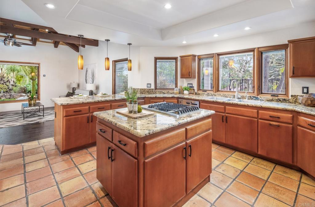 2202 Mountain Vista Drive Encinitas, CA 92024 - Photo 10 of 28 a kitchen with a sink stove and cabinets