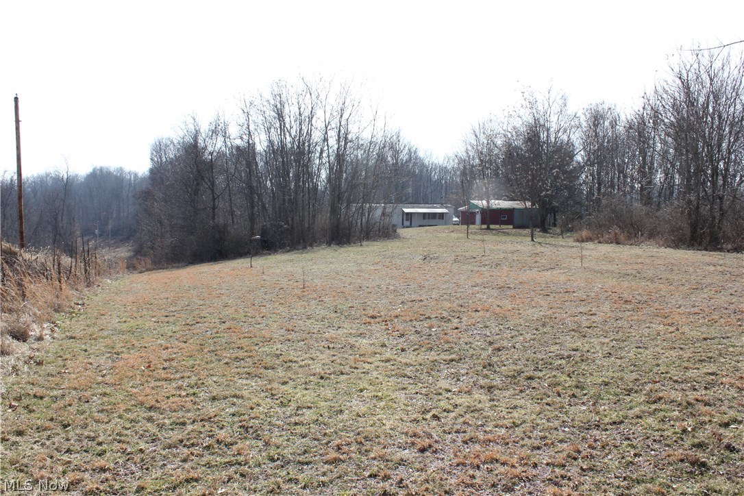 74782 Science Hill Road Kimbolton, OH 43749 - Photo 10 of 26 Property line runs down fence line along Electric poles