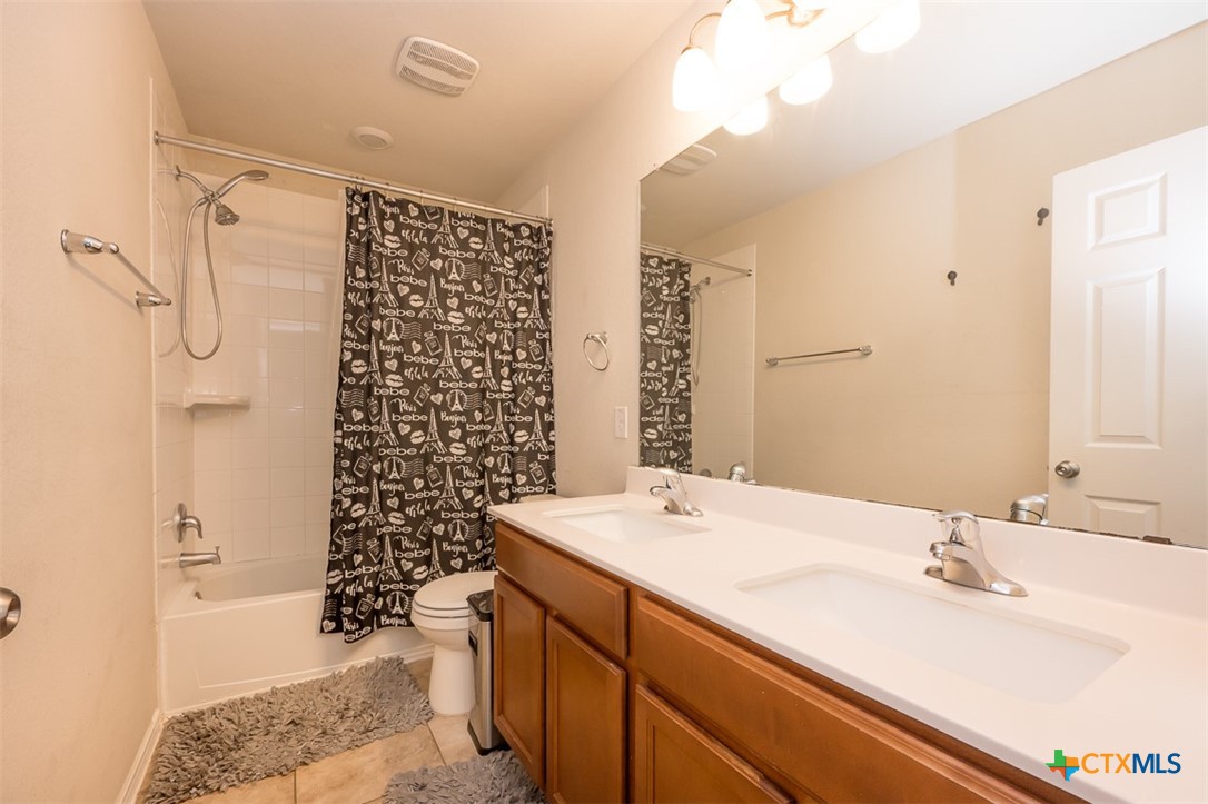 2511 Pintail Loop Copperas Cove, TX 76522 - Photo 17 of 26 a bathroom with a sink and a mirror