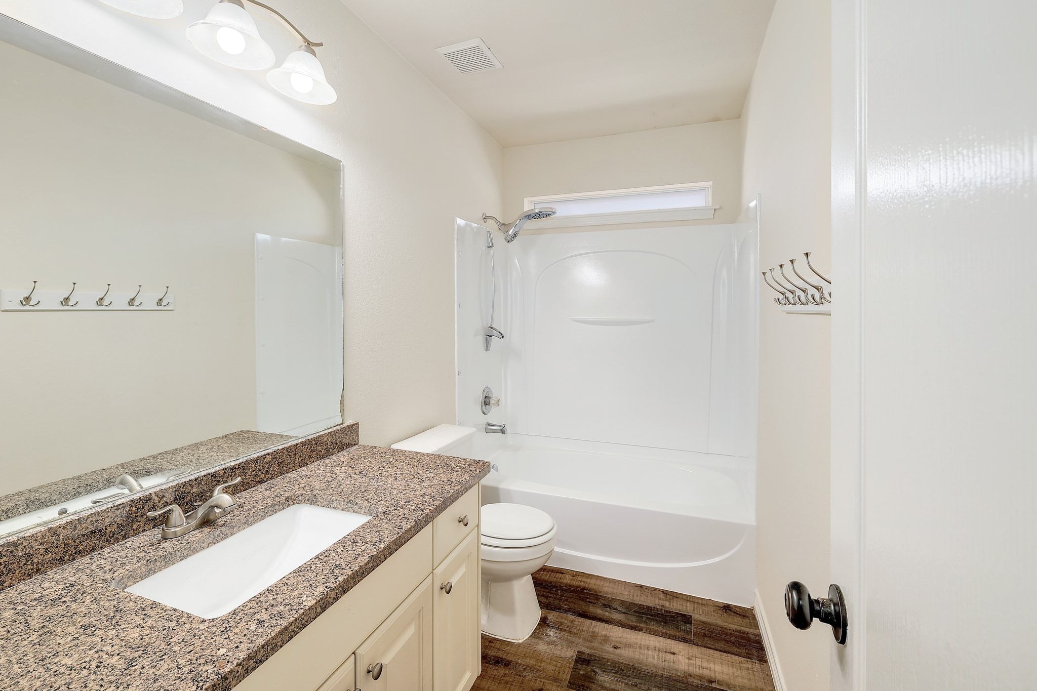 2307 Hayfield Square Pflugerville, TX 78660 - Photo 33 of 40 a bathroom with a granite countertop sink toilet and shower