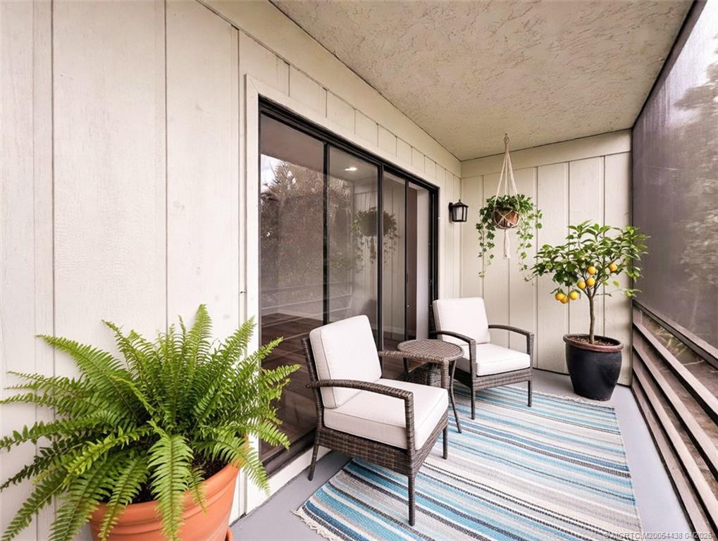 800 Northwest Fork Road, Unit 107 Stuart, FL 34994 - Photo 8 of 21 a outdoor living room with furniture