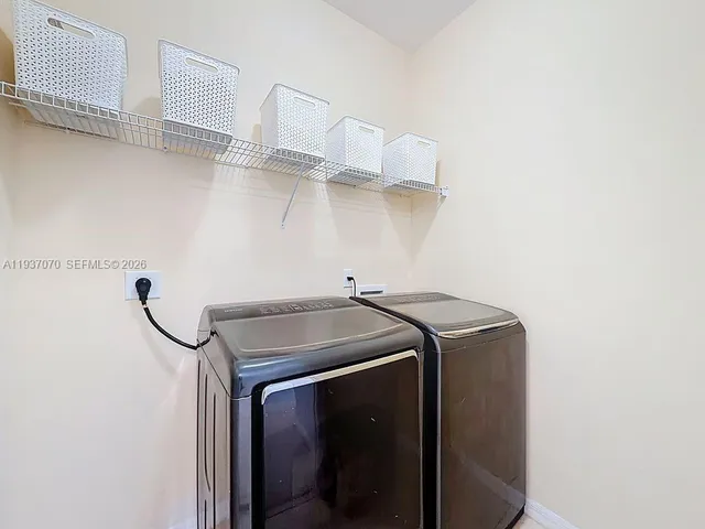a bathroom with a sink mirror and vanity