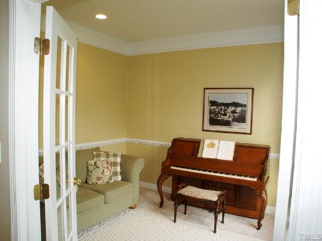 1509 Patterson Grove Road Apex, NC 27502 - Photo 3 of 12 Formal living room has french doors and would serve nicely as a private home office.