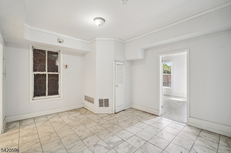904 2nd Avenue, Unit 2 Elizabeth, NJ 07201 - Photo 12 of 19 an empty room with windows