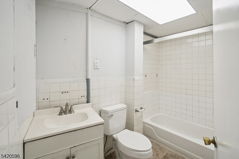 904 2nd Avenue, Unit 2 Elizabeth, NJ 07201 - Photo 6 of 19 a bathroom with a sink toilet and shower