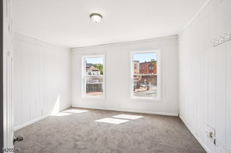 904 2nd Avenue, Unit 2 Elizabeth, NJ 07201 - Photo 8 of 19 an empty room with windows