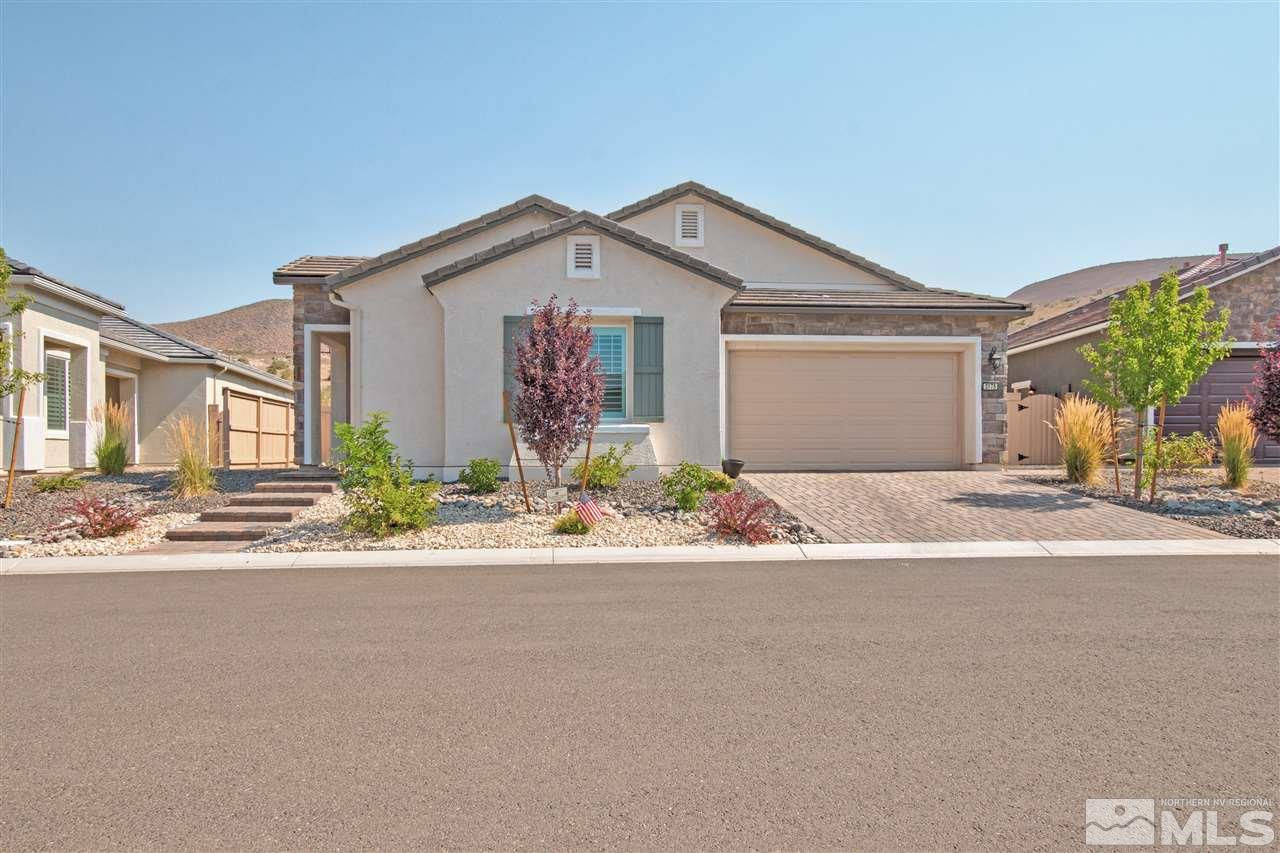 3175 Show Jumper Lane Reno, NV 89521 - Photo 1 of 40 a front view of a house with a yard and a garage