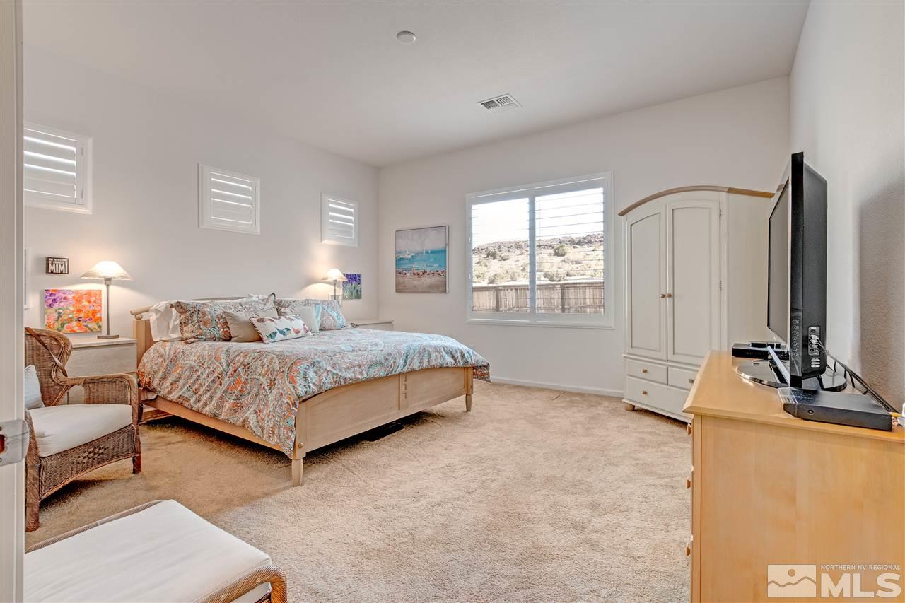 3175 Show Jumper Lane Reno, NV 89521 - Photo 12 of 40 a bedroom with a bed bathroom and window