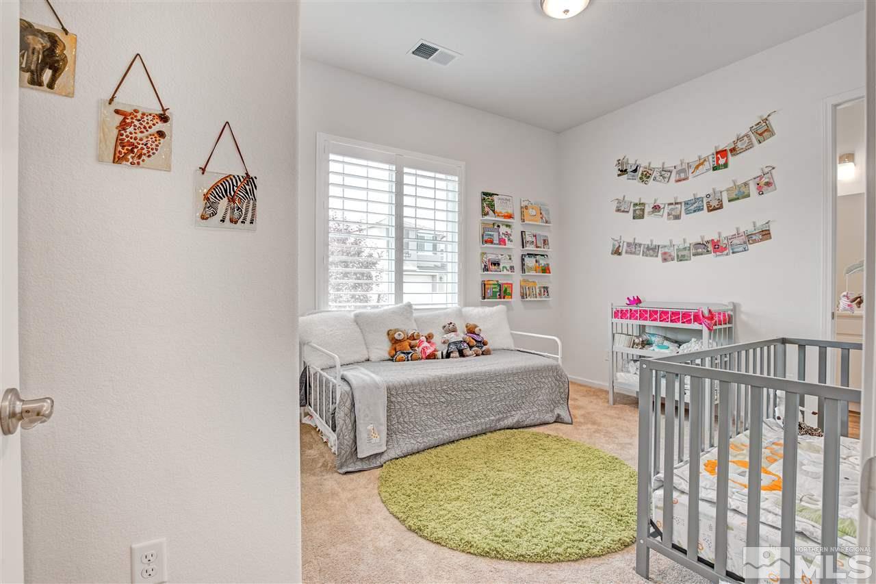 3175 Show Jumper Lane Reno, NV 89521 - Photo 24 of 40 a bedroom with a bed and a window