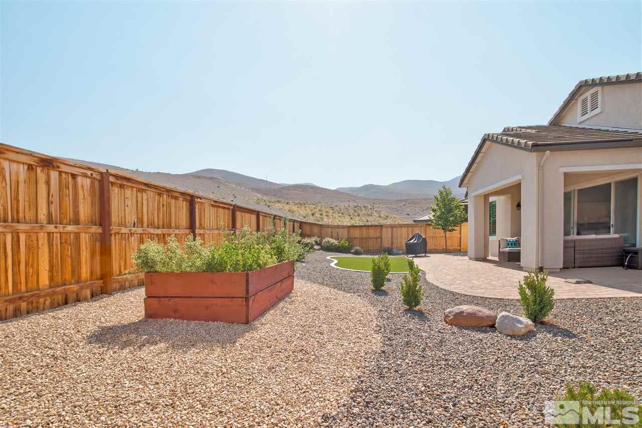 3175 Show Jumper Lane Reno, NV 89521 - Photo 30 of 40 a view of house with backyard and seating space