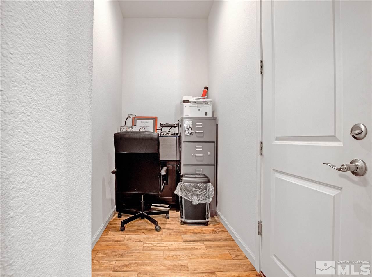 3175 Show Jumper Lane Reno, NV 89521 - Photo 33 of 40 a workspace with furniture and wooden floor