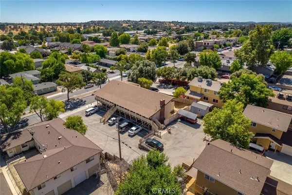 an aerial view of a house with a yard