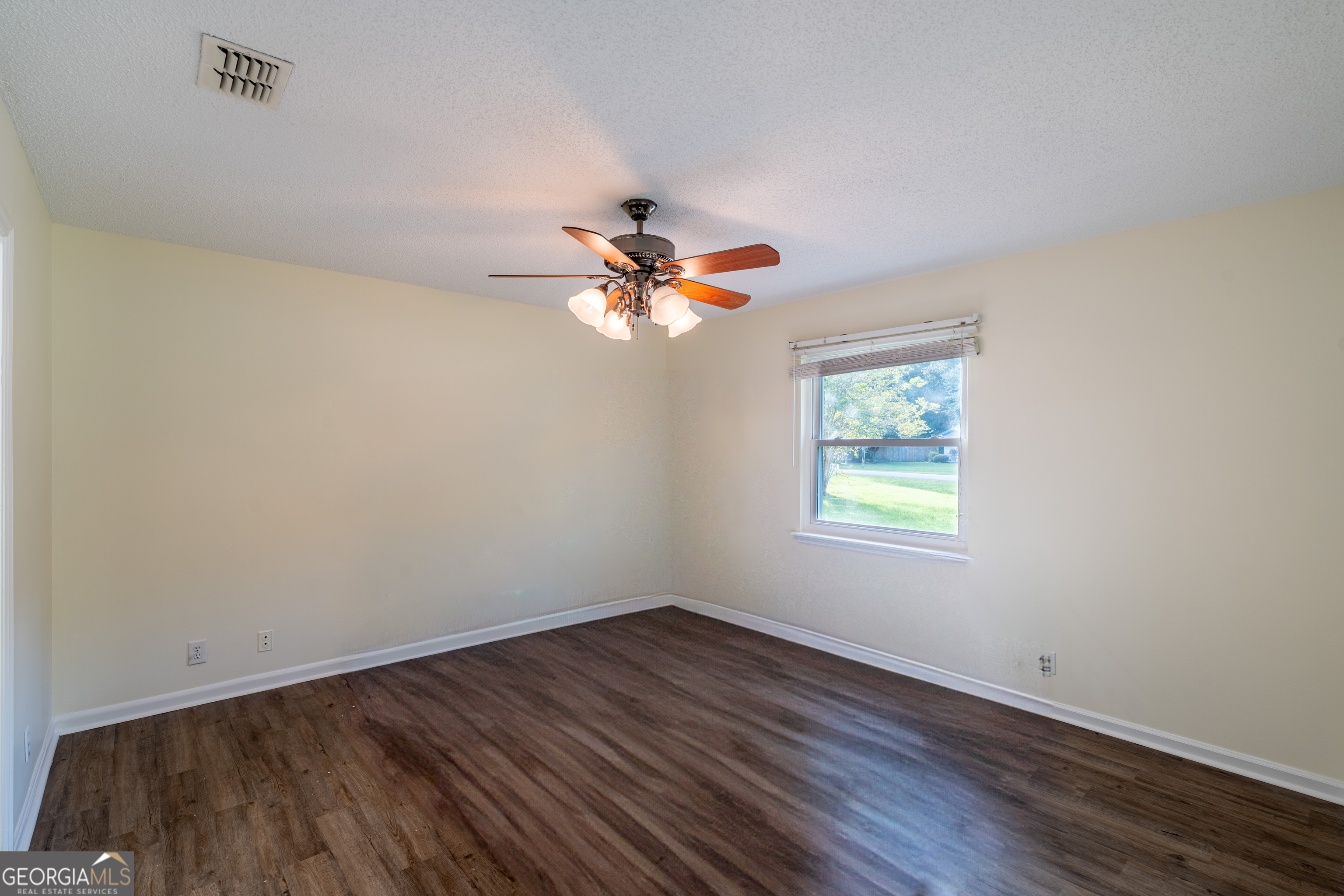 404 Potomac Court St. Marys, GA 31558 - Photo 15 of 30 wooden floor in an empty room with a window