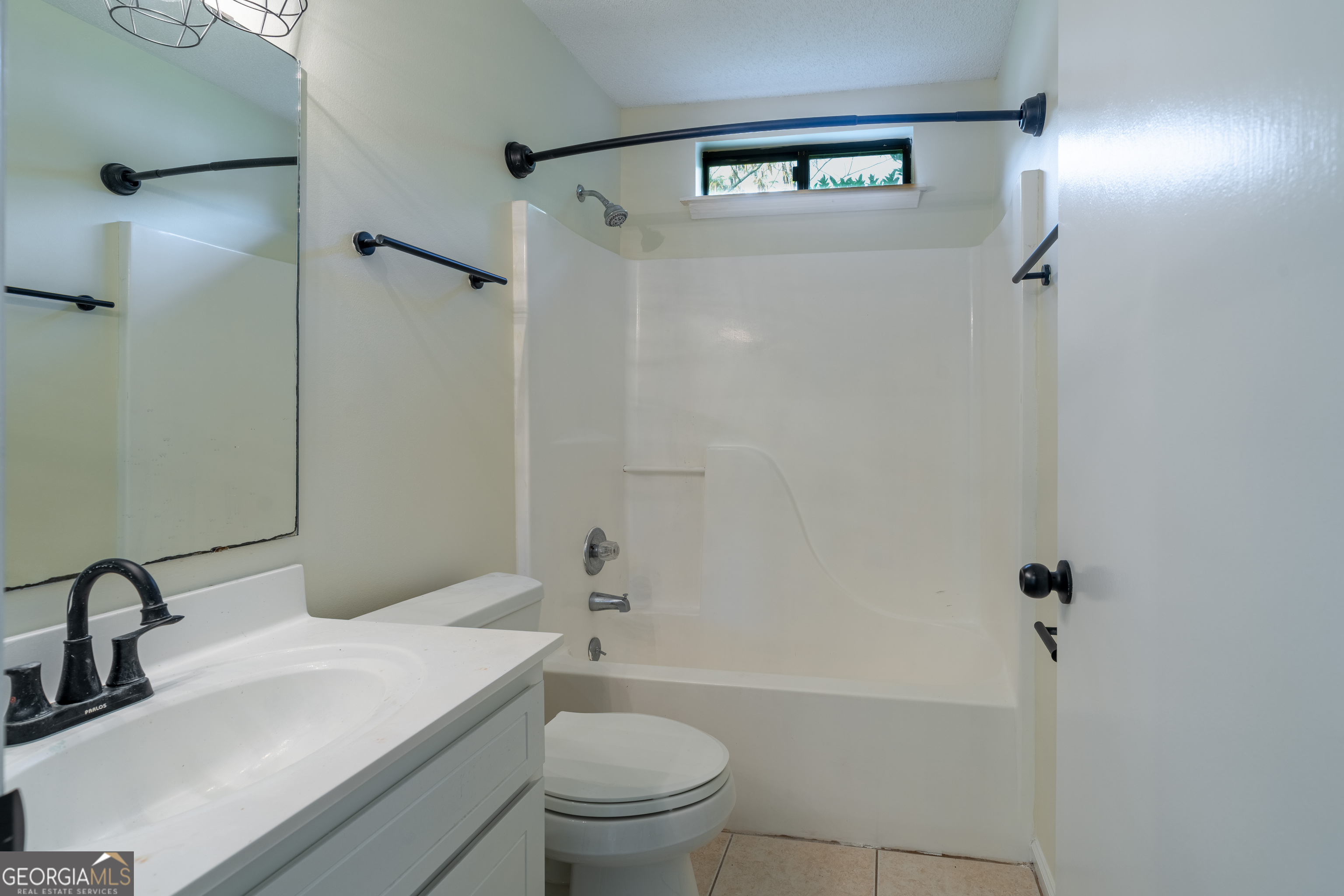 404 Potomac Court St. Marys, GA 31558 - Photo 23 of 30 a bathroom with a sink a toilet and shower
