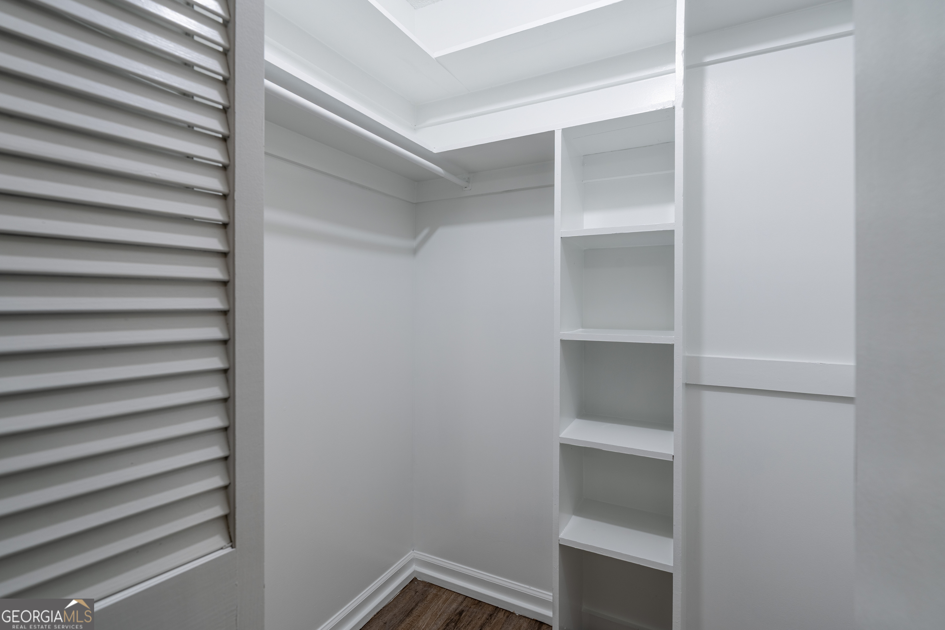404 Potomac Court St. Marys, GA 31558 - Photo 26 of 30 a view of walk in closet with empty racks