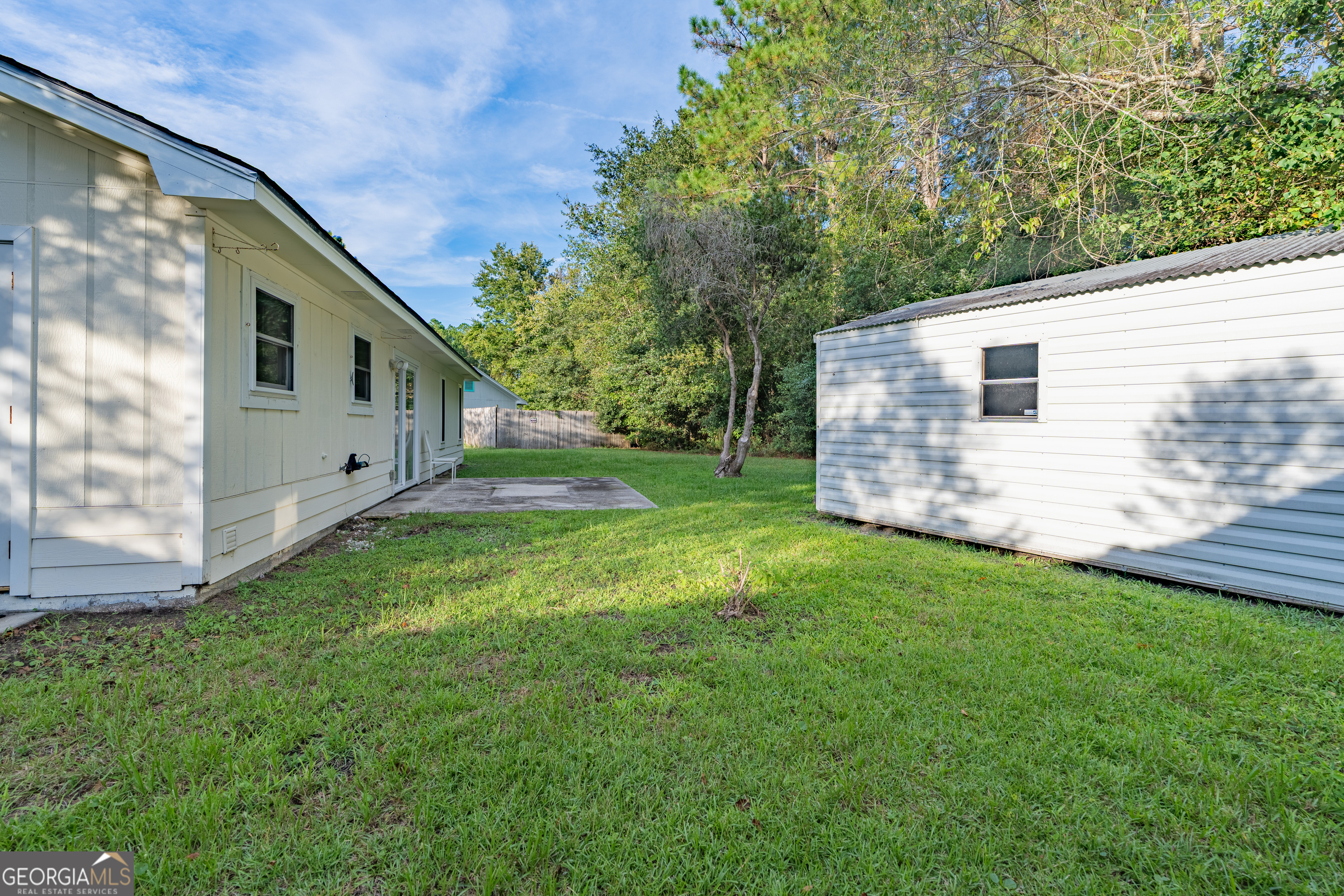 404 Potomac Court St. Marys, GA 31558 - Photo 29 of 30 a backyard of a house with lots of green space