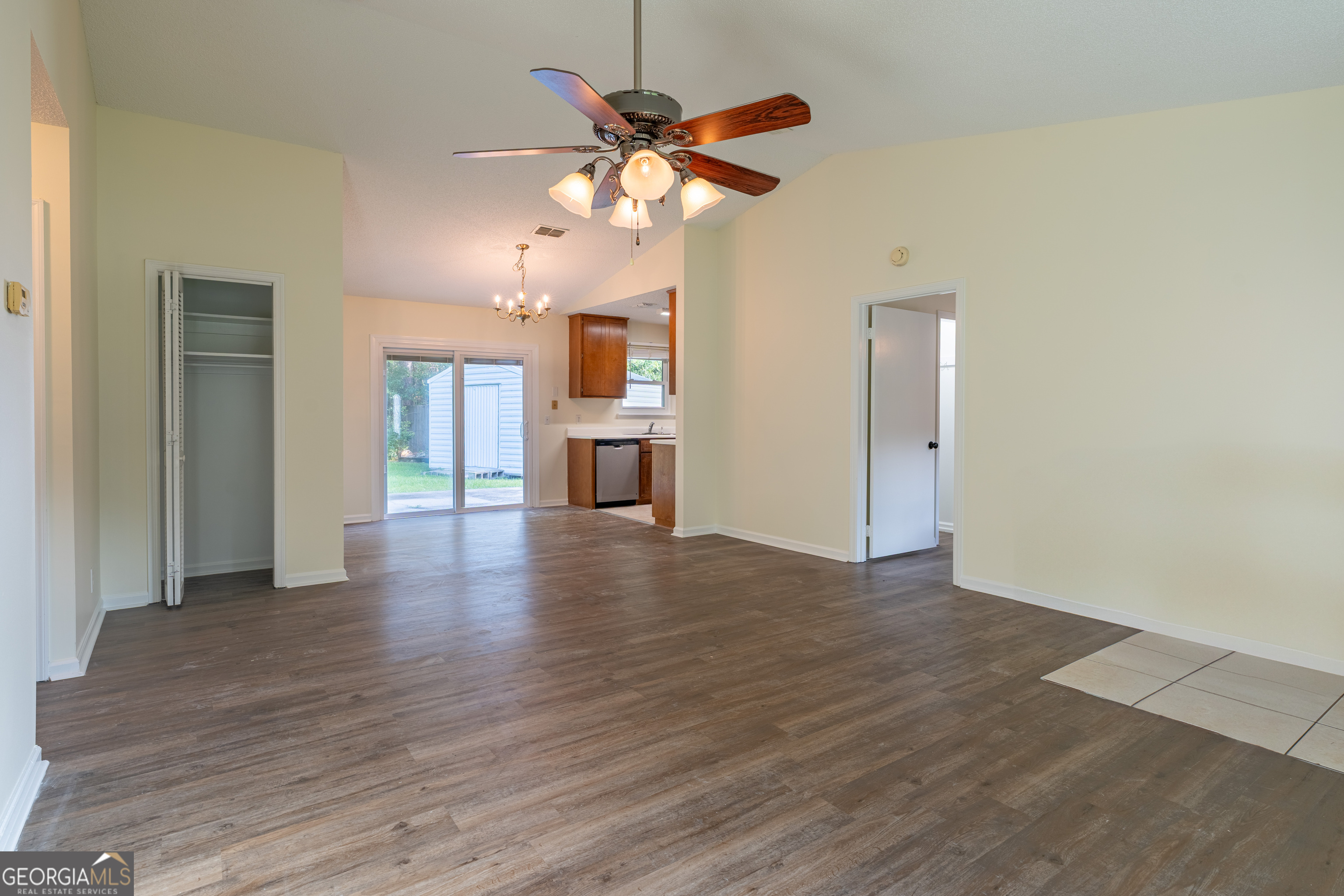 404 Potomac Court St. Marys, GA 31558 - Photo 8 of 30 a view of an empty room with a window and wooden floor