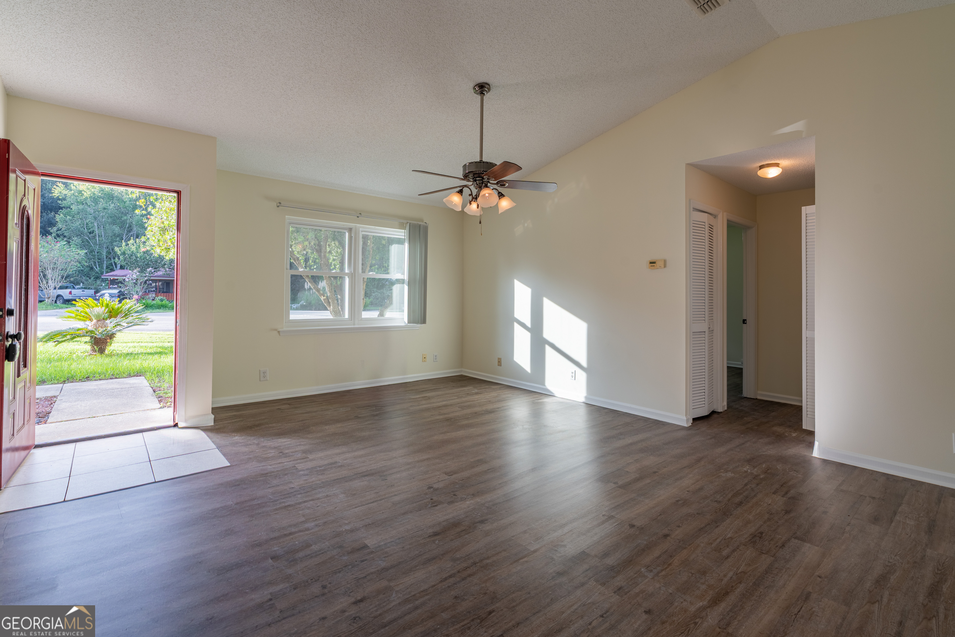 404 Potomac Court St. Marys, GA 31558 - Photo 10 of 30 a view of livingroom with window wooden floor and front door