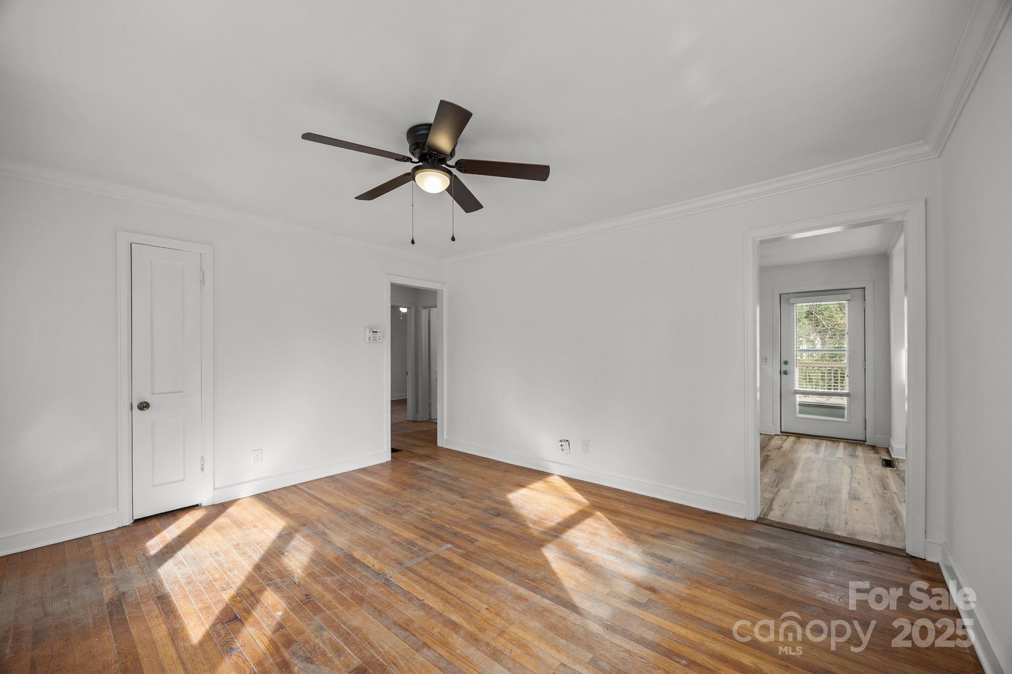175 Chatham Road Asheville, NC 28804 - Photo 14 of 48 a view of empty room with wooden floor and fan